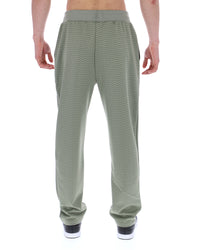 Displays a model wearing the Sea Foam 'FILA' branded Edward Herringbone Pant
