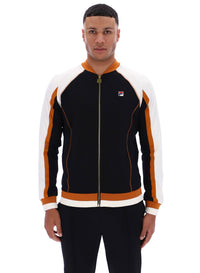 Man wearing a black and orange tracksuit with a visible FILA logo on a white background