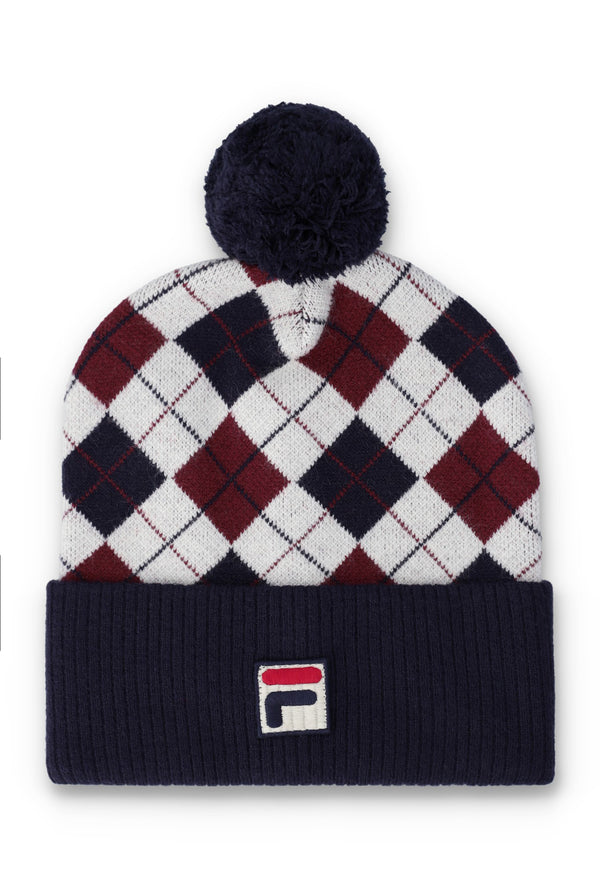 A Fila knit pom-pom beanie hat featuring an argyle pattern in white, navy, and burgundy, with a navy ribbed cuff and a small Fila logo patch on the front.