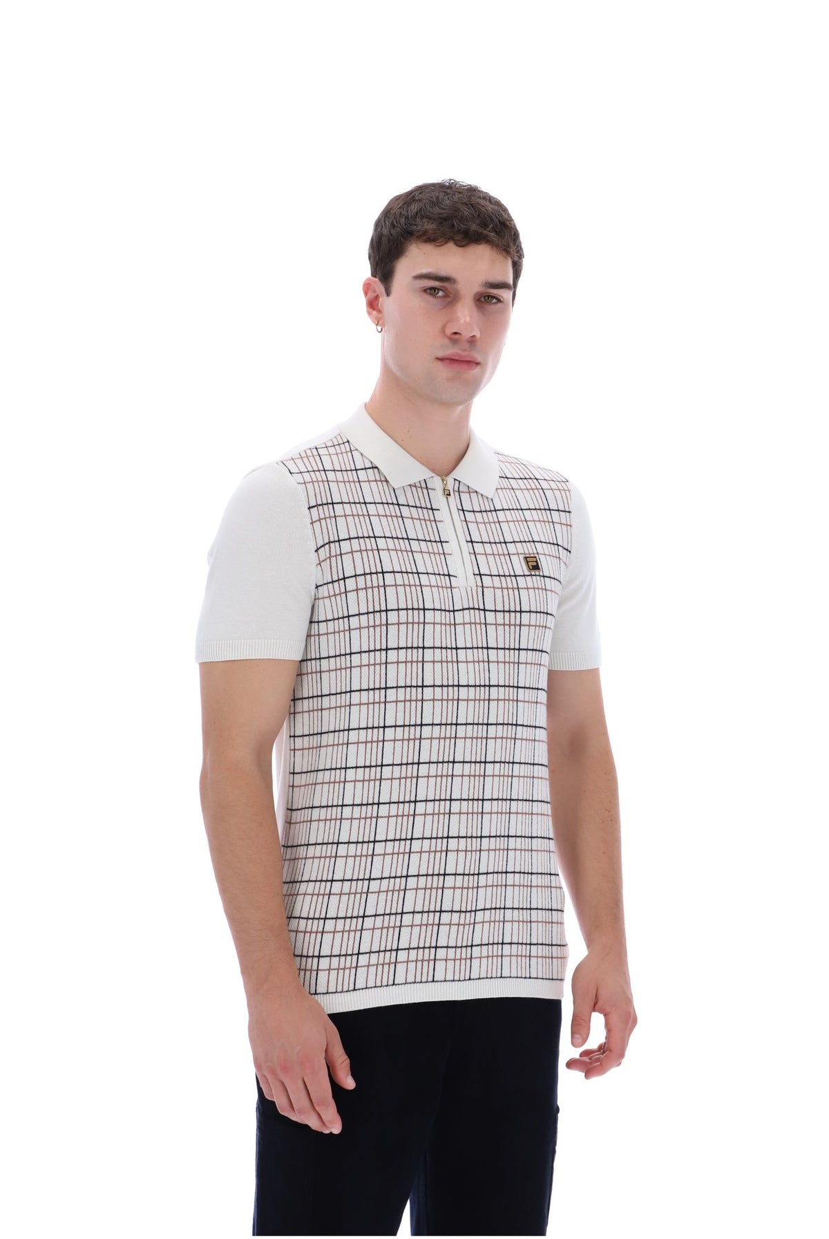 A man wearing a short-sleeve polo shirt with a white base, beige and brown plaid pattern on the front, and solid white sleeves, paired with black pants, against a plain white background.