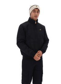 Displays a model wearing the Black 'FILA' branded Etton Bomber Jacket