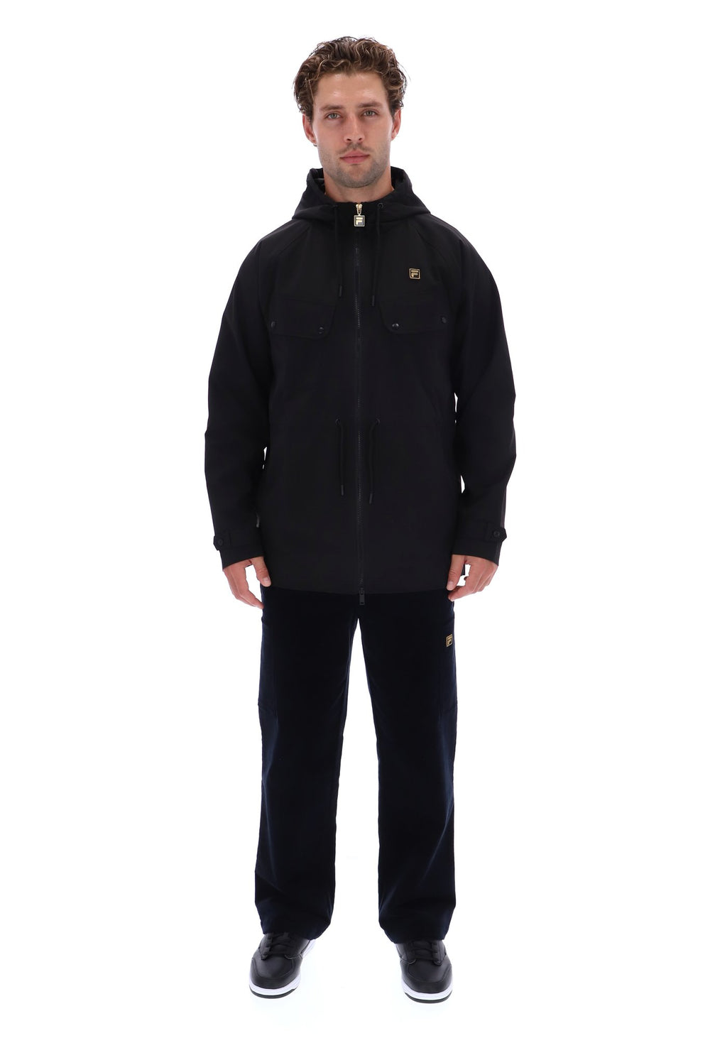 Displays a model wearing the Black 'FILA' branded Fabroni Hooded Parka