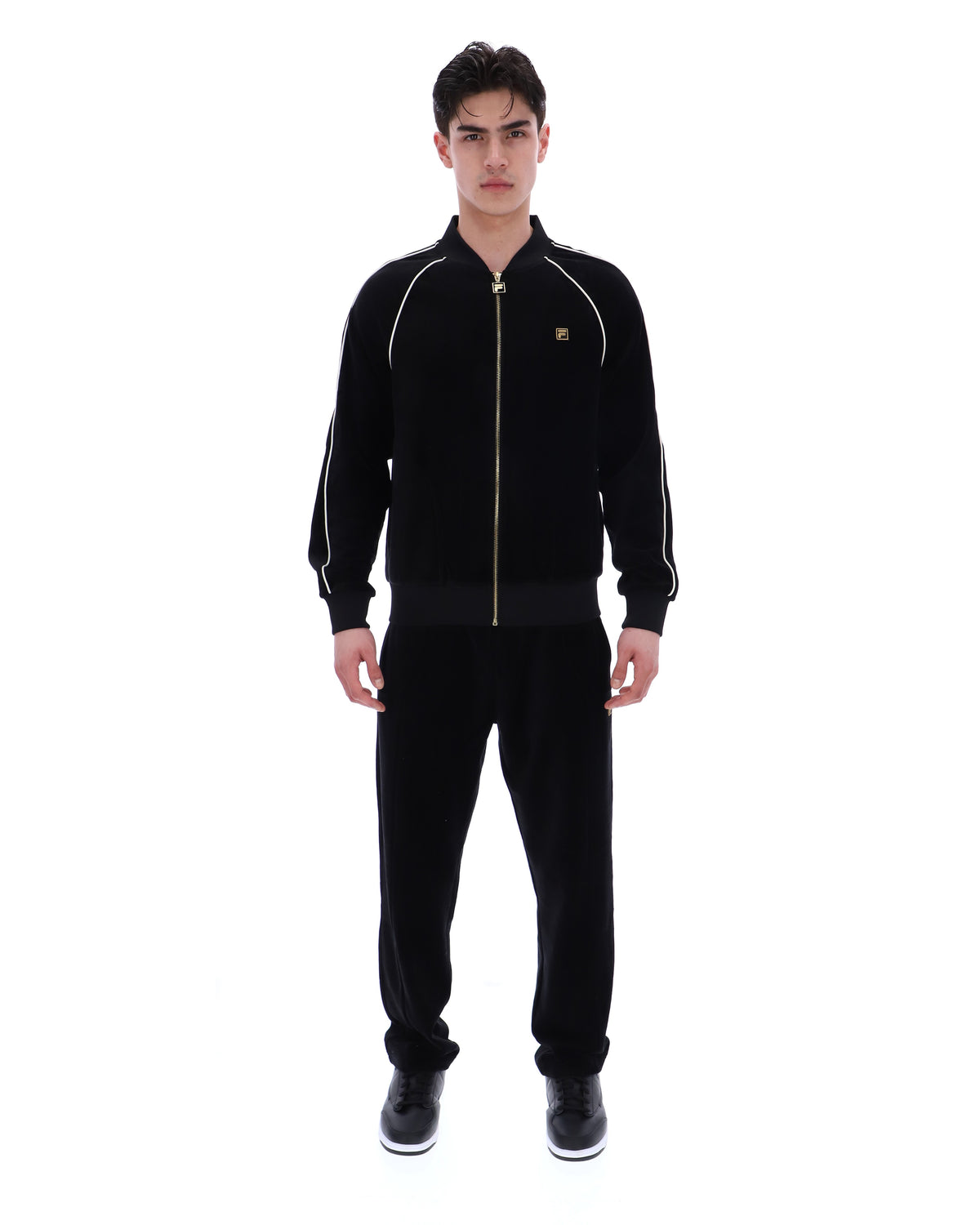 Displays a model wearing the Black 'FILA' Fella Velour Jacket