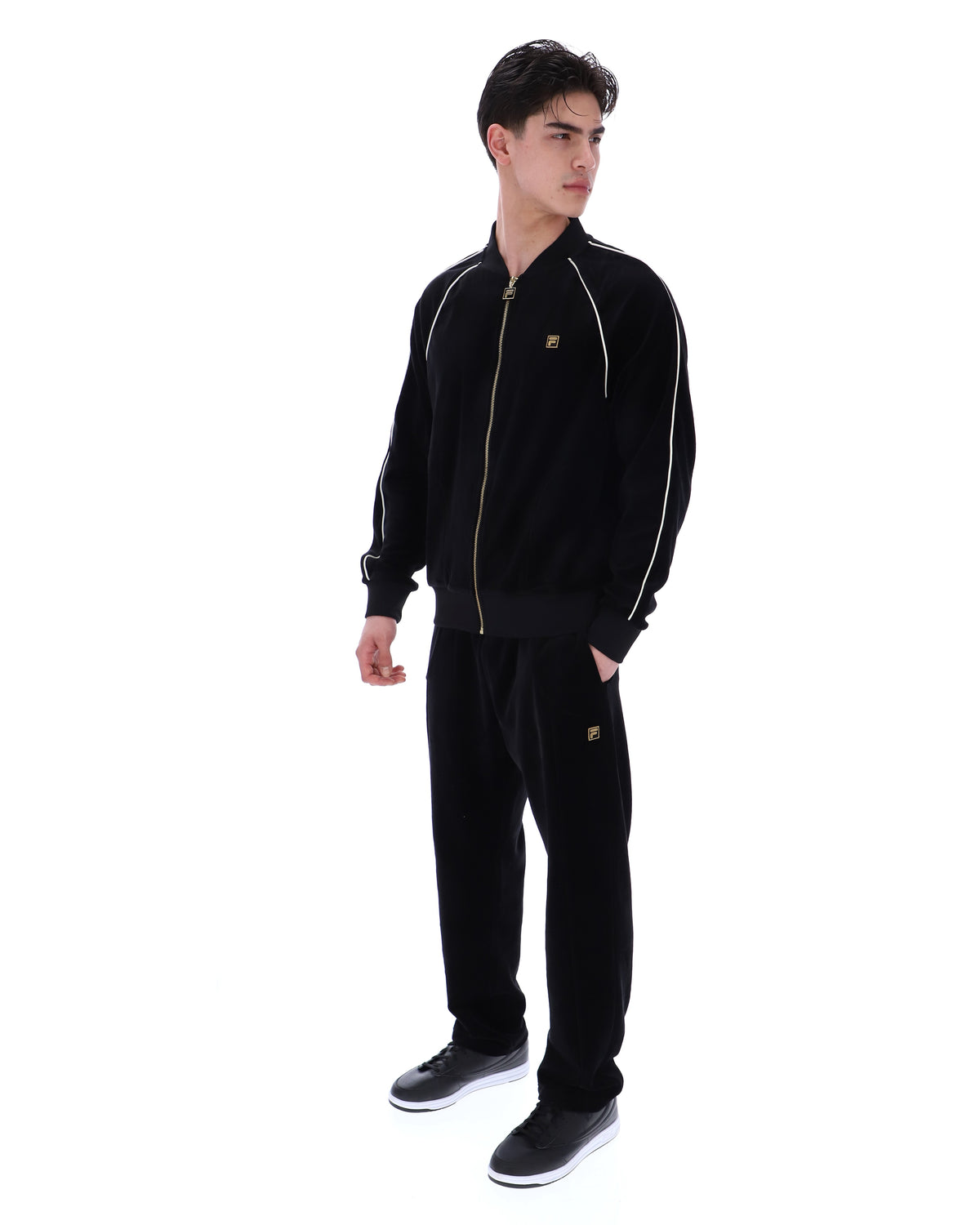 Displays a model wearing the Black 'FILA' Fella Velour Jacket