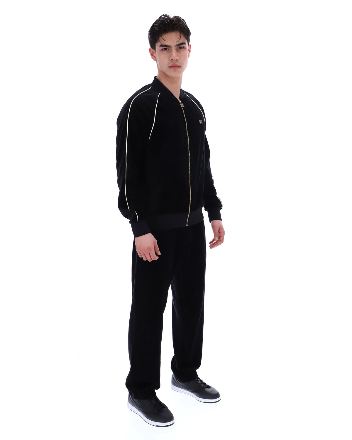 Displays a model wearing the Black 'FILA' Fella Velour Jacket