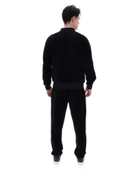 Displays a model wearing the Black 'FILA' Fella Velour Jacket