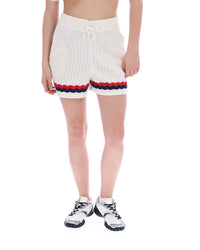 Displays a model wearing the Fino 'FILA' branded Knitted Crochet Shorts