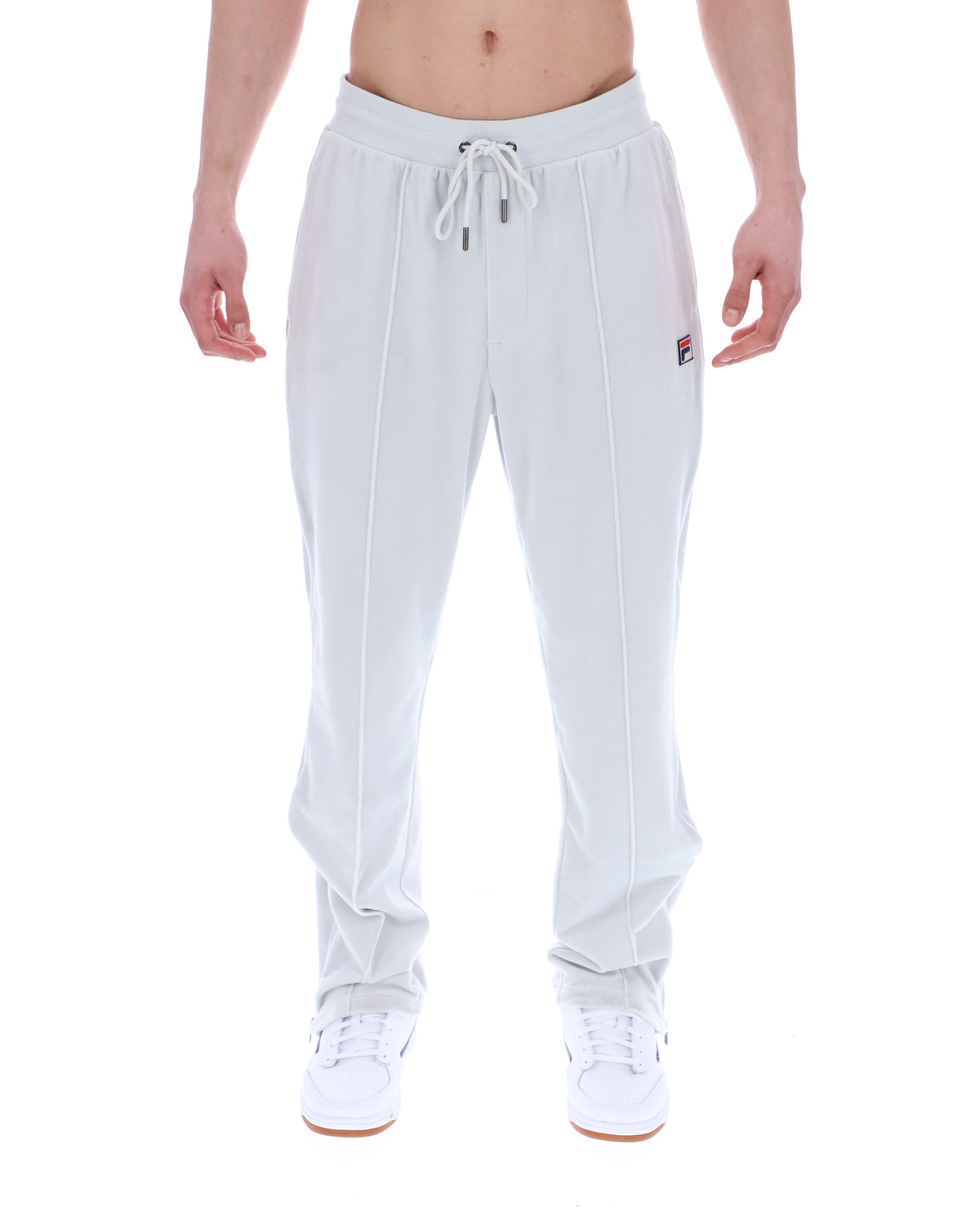 Light Grey jogger pants worn by a person on a white background