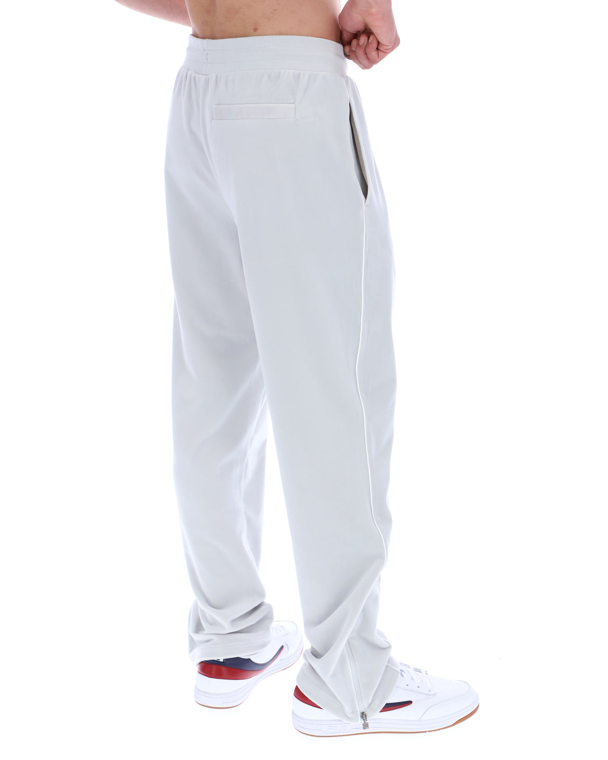 Light Grey pants worn by a person on a white background