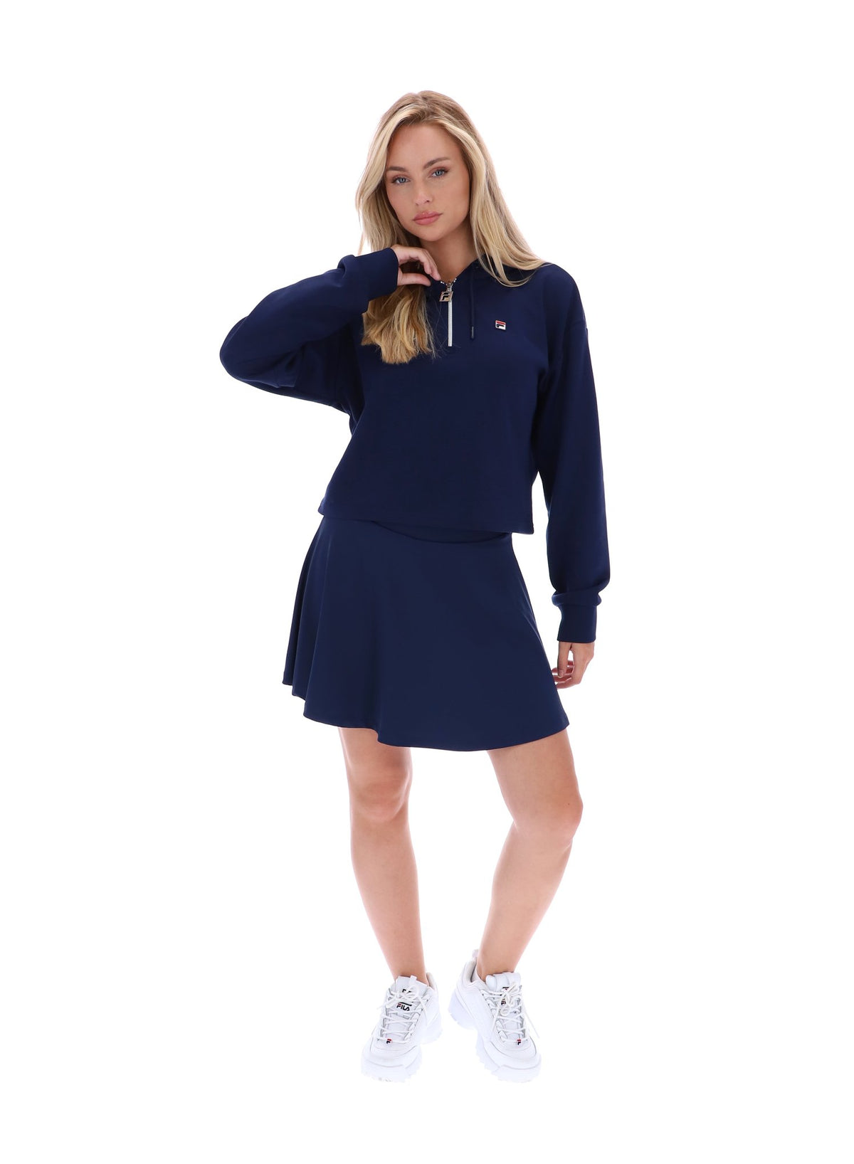 Displays a model wearing the Navy 'FILA' branded Fiorella 1/4 Zip Up Hoodie