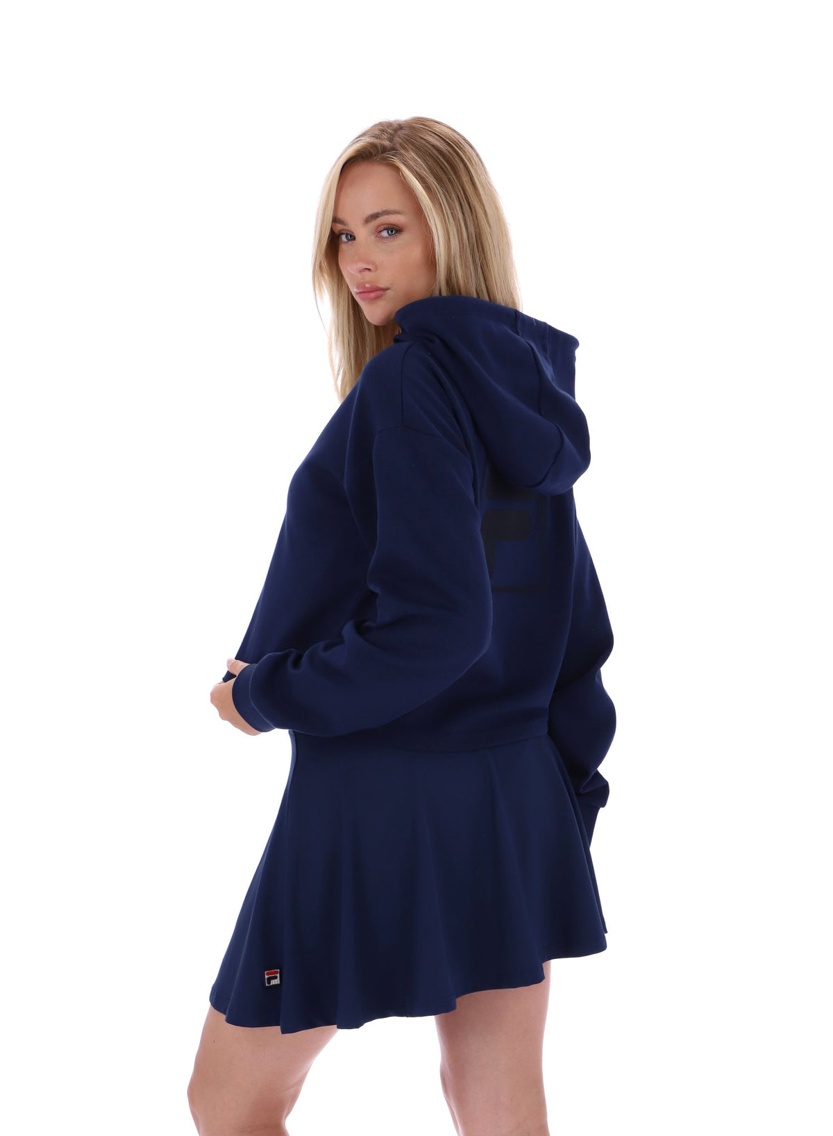 Displays a model wearing the Navy 'FILA' branded Fiorella 1/4 Zip Up Hoodie