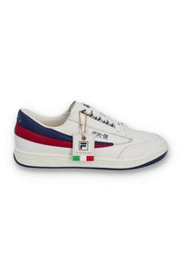 A pair of FILA FX 2 CASA TRAINER sneakers with white uppers, red, blue, and white laces, and red and navy blue detailing.