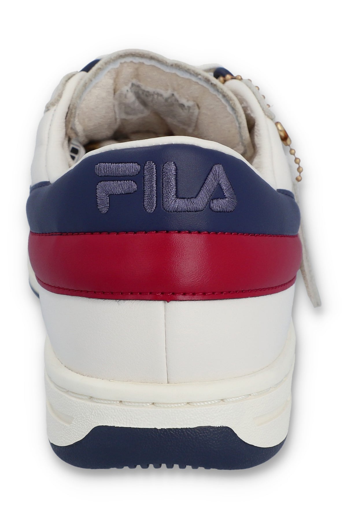 A pair of FILA FX 2 CASA TRAINER sneakers with white uppers, red, blue, and white laces, and red and navy blue detailing.