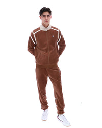 Man wearing a brown tracksuit with white accents on a white background