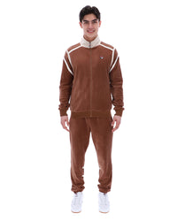 Man wearing a brown tracksuit with white accents on a white background