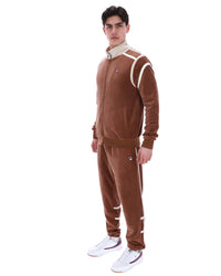Man wearing a brown tracksuit with white accents on a white background
