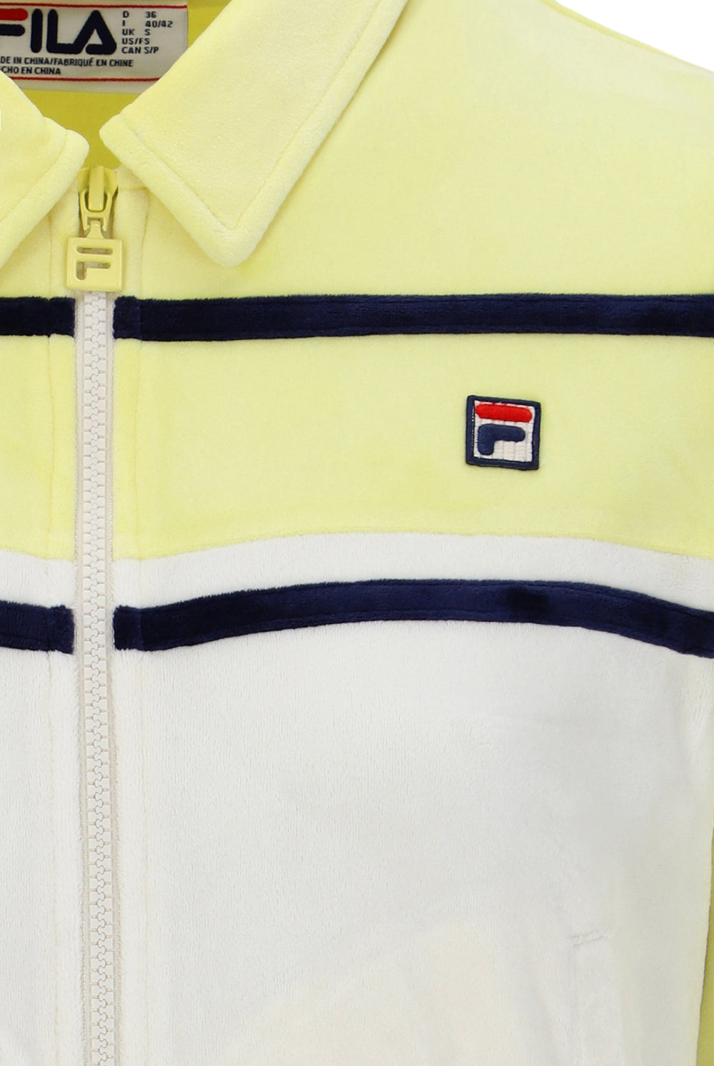 Close-up of a yellow and white jacket with a FILA logo on a white background