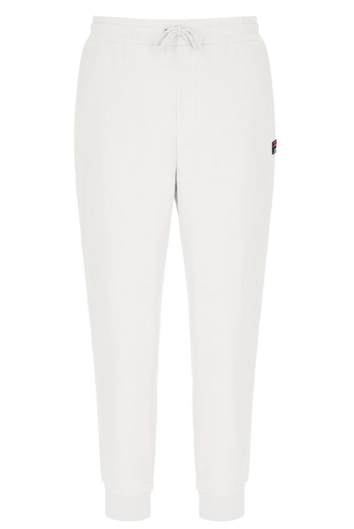 White jogger pants with a small FILA logo on a white background