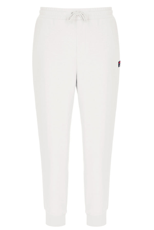 White jogger pants with a small FILA logo on a white background
