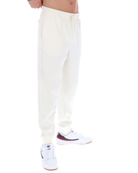 White sweatpants worn by a person on a white background