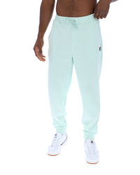 Light blue jogger pants worn by a person on a white background