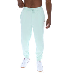 Light blue jogger pants worn by a person on a white background