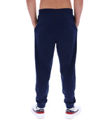 Navy blue sweatpants worn by a person on a white background