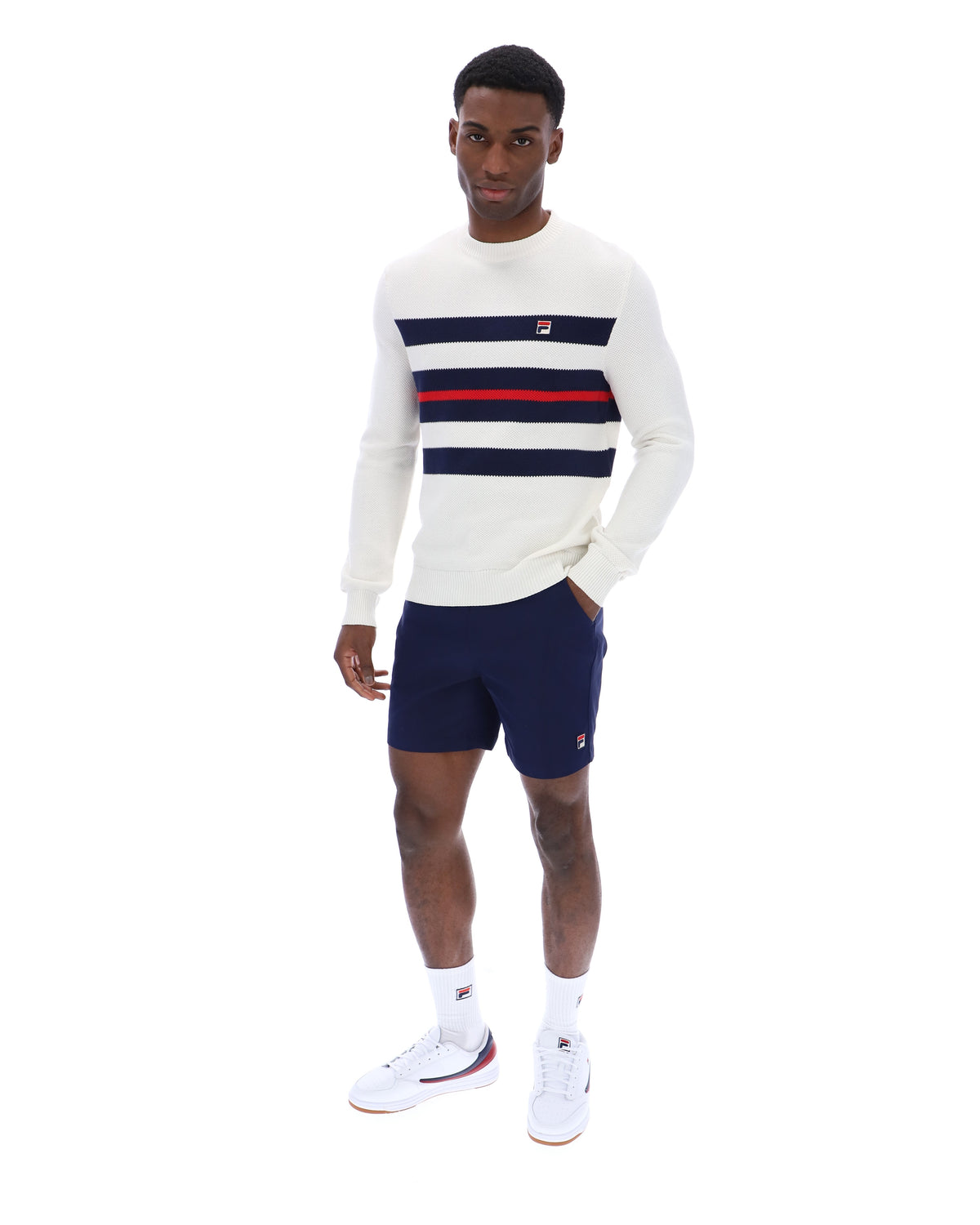 Displays a model wearing the Gardenia 'FILA' branded Giuseppe Mesh Stripe Knitted Crew Neck