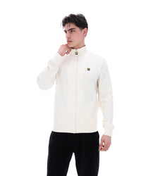 Man wearing a white jacket with a brand logo on a white background