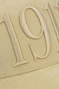 Displays the Classic Beige 'FILA' branded Hazza Large 1911 Embroidered Mesh-Back Cap featuring the 1911 branding 