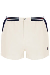White shorts with navy and red striped waistband on a white background