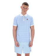 Man wearing a light blue checkered polo shirt and shorts on a white background