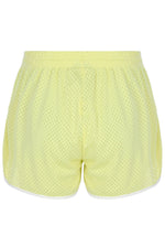 Yellow mesh shorts on a white background