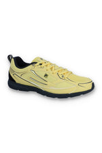 Yellow athletic shoe with black sole on a white background