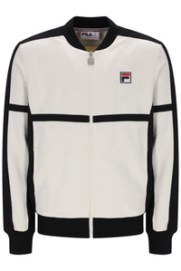 A FILA track jacket in off-white and black, featuring a full-zip front, ribbed collar, cuffs, and hem, with the FILA logo patch on the left chest.