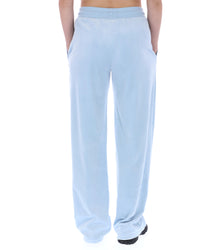 Light blue sweatpants worn by a person on a white background