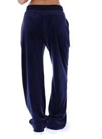 Navy blue velvet pants on a white background