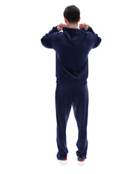 Displays a model wearing the Navy 'Fila' branded Italo Velour Hoodie