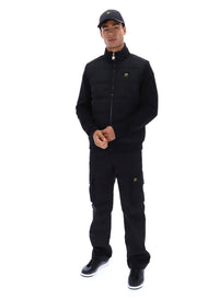 Displays a model wearing the Black 'FILA' branded Jerry Full Zip Padded Jacket