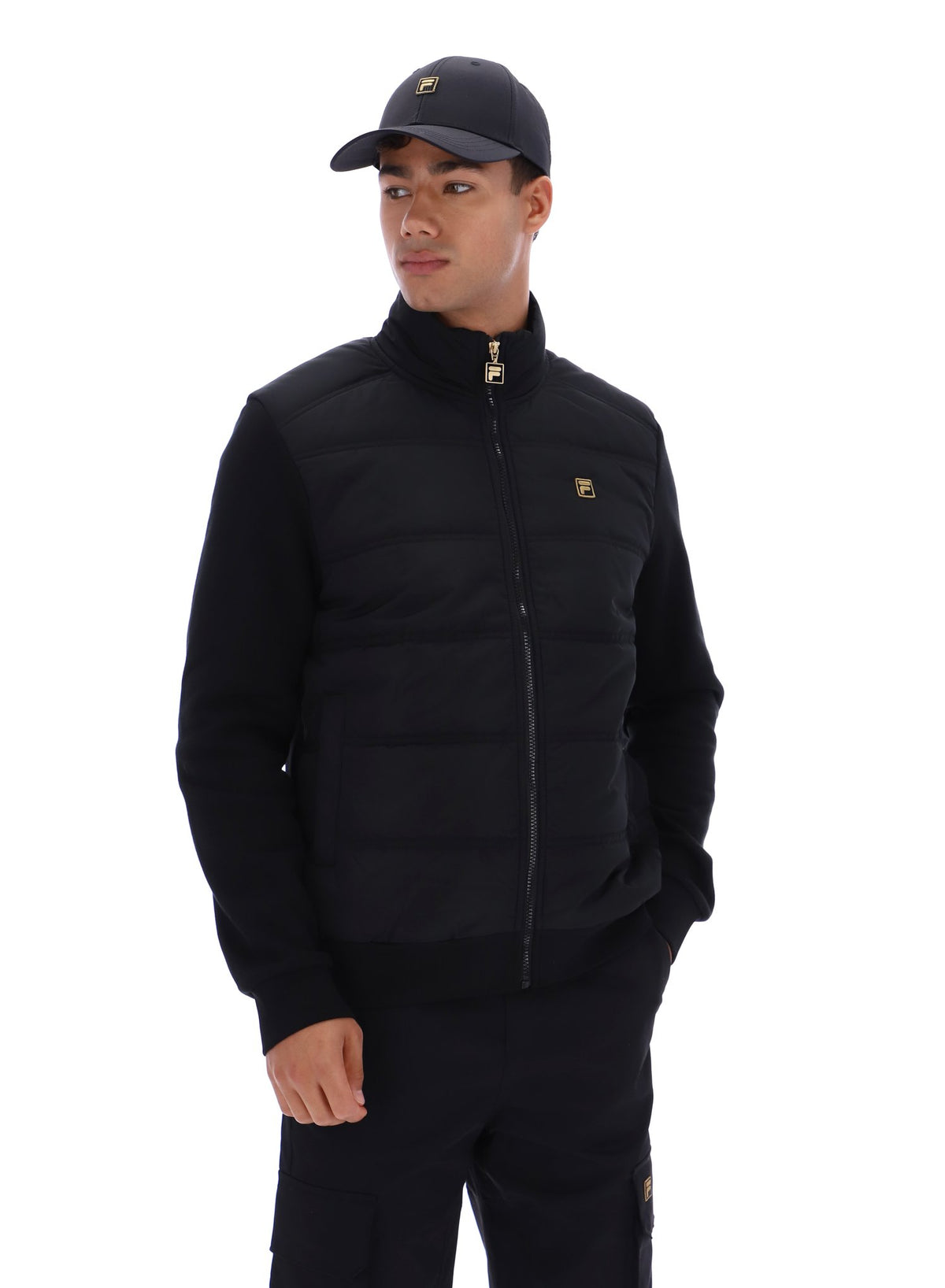Displays a model wearing the Black 'FILA' branded Jerry Full Zip Padded Jacket