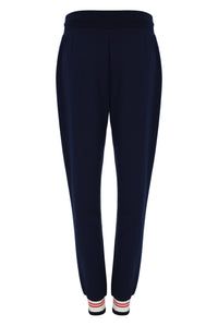 Navy blue pants with striped socks on a white background