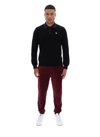 Displays a model wearing the Black 'FILA' branded Kobe Striped Knit Polo
