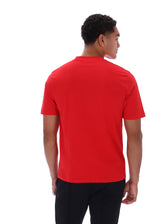 A man wearing a bright red short-sleeve polo shirt, shown from the back against a plain white background.