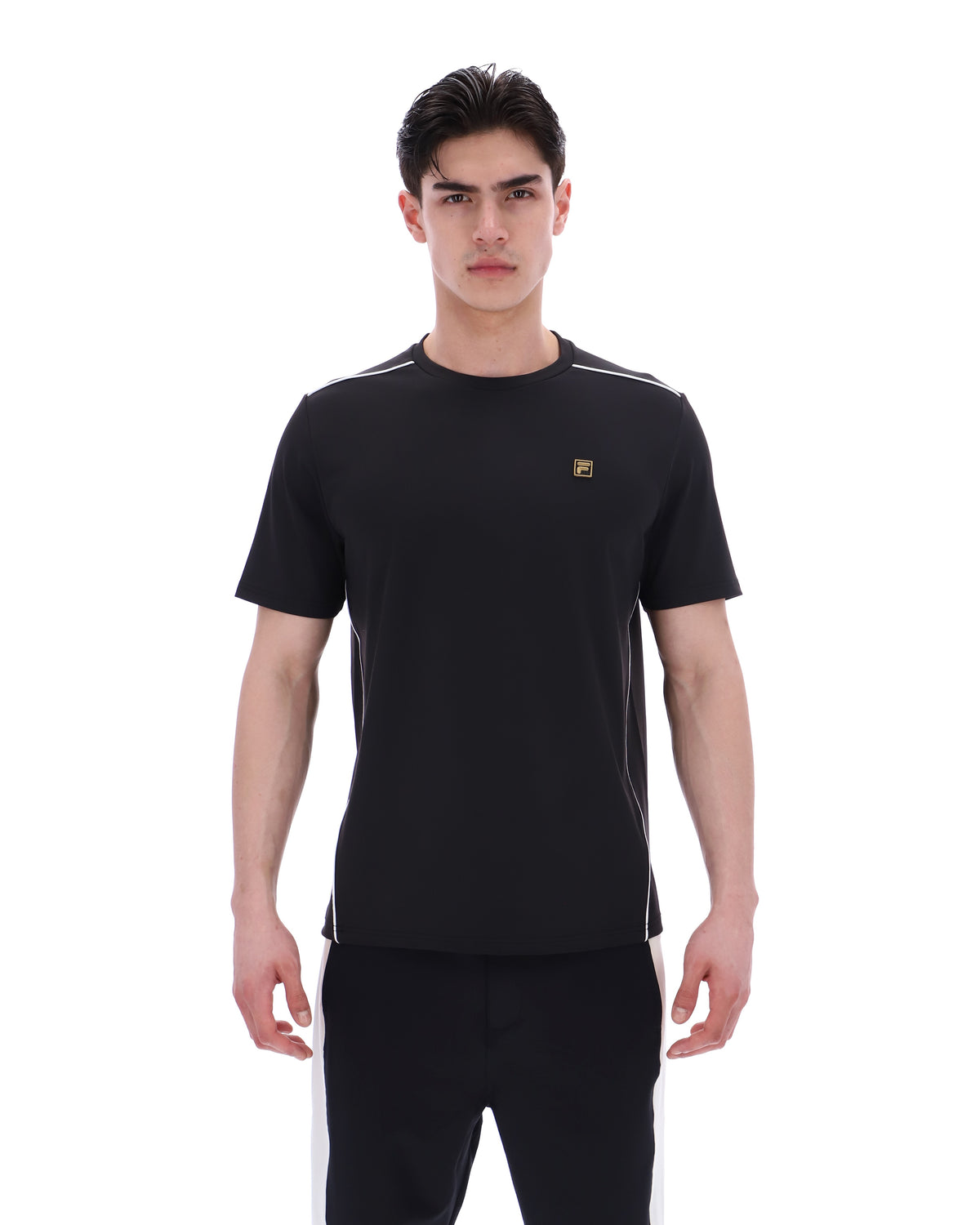 Man wearing a black t-shirt with a logo on a white background