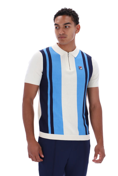 A man wearing a short-sleeve knit polo vest with vertical stripes in navy, light blue, and white, featuring a half-zip collar and a small Fila logo on the chest.