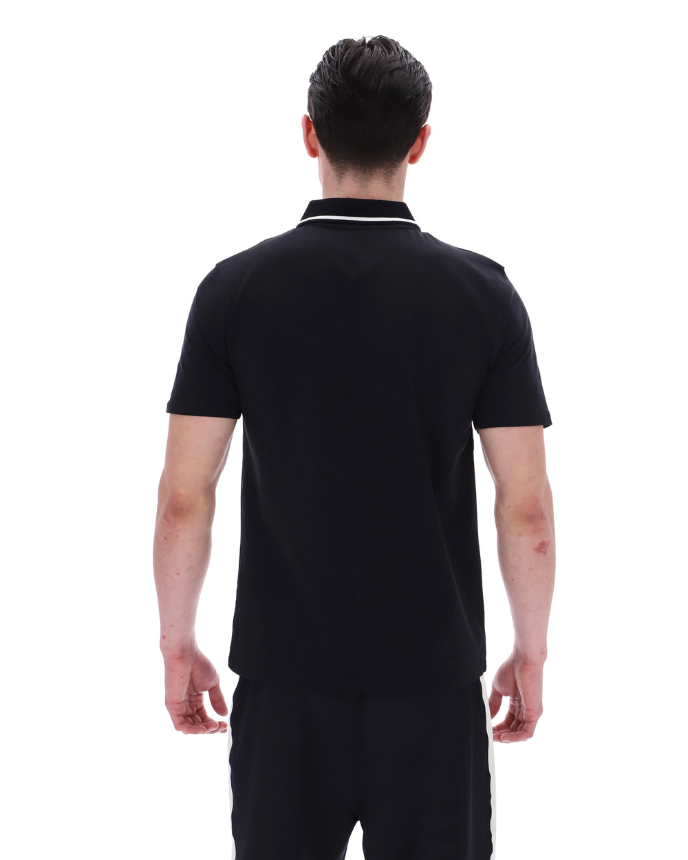Man wearing a black polo shirt on a white background