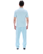 Person wearing a light blue outfit on a white background