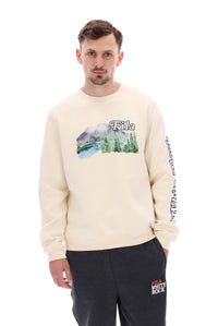 A male model wearing a beige FILA Len Graphic Crew Sweatshirt with a mountain range and brand logo on the front.