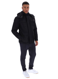 Displays a model wearing the Black 'FILA' branded Liam Cargo Padded Jacket