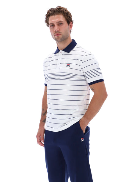 Displays a model wearing the White 'FILA' branded Navy Logan Stripe Polo